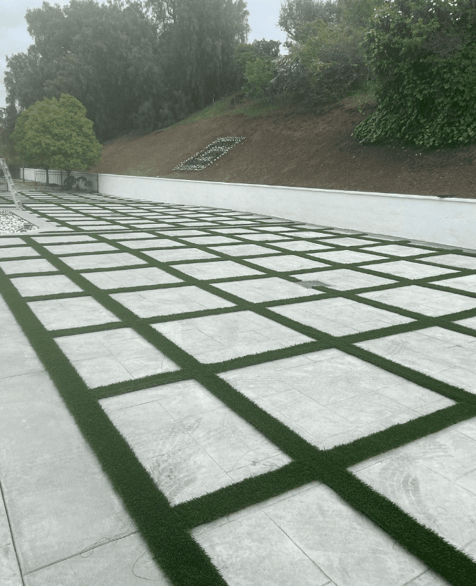 rectangle pavers surrounded by turf